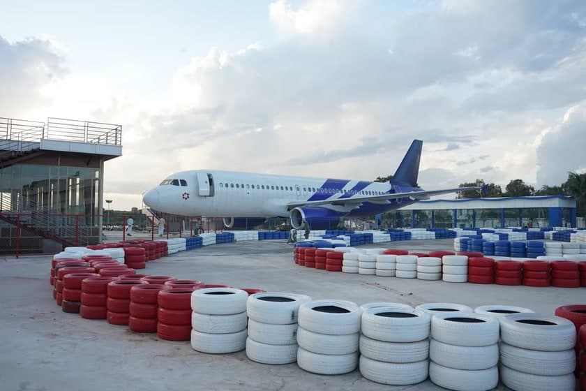 The Fly High aircraft office in Hyderabad seen past the go-kart tyre barriers