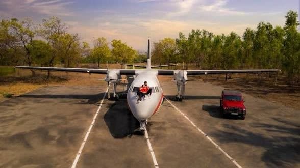 Wide view of the Pixocity twin-turboprop aircraft on its painted apron in Surat